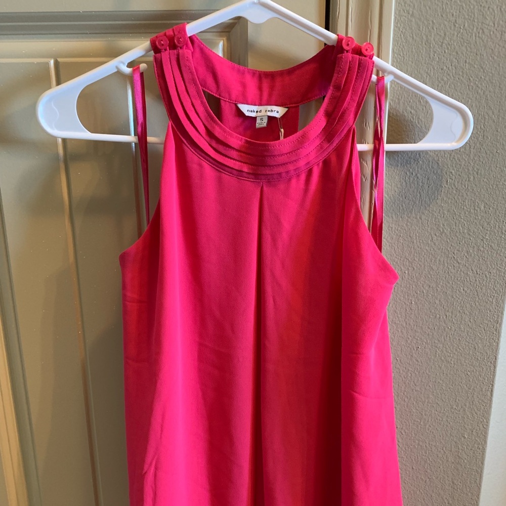 New w/tags. Pink halter, open back tank. Small
